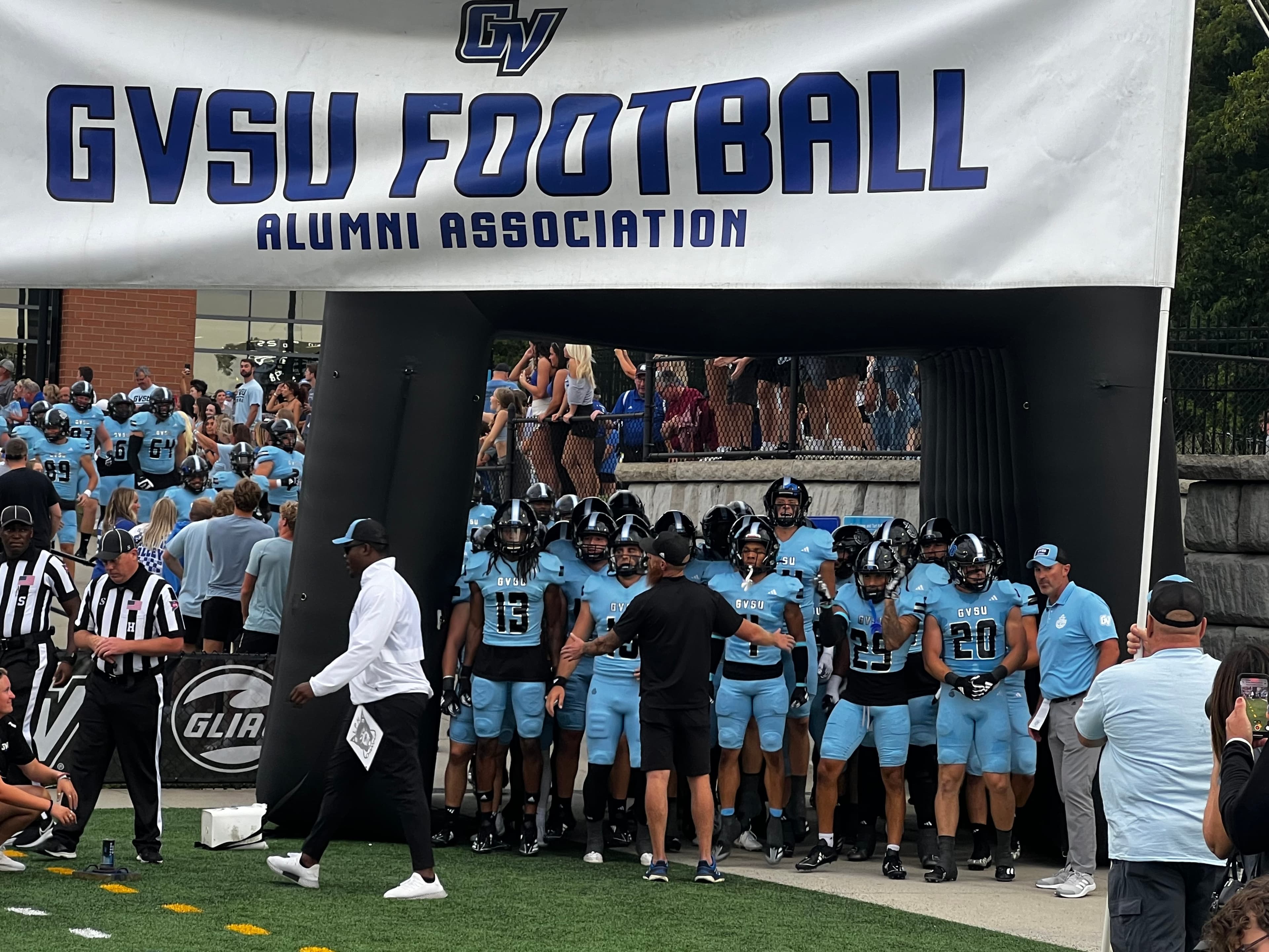 Grand Valley players running out of tunnel to kickoff